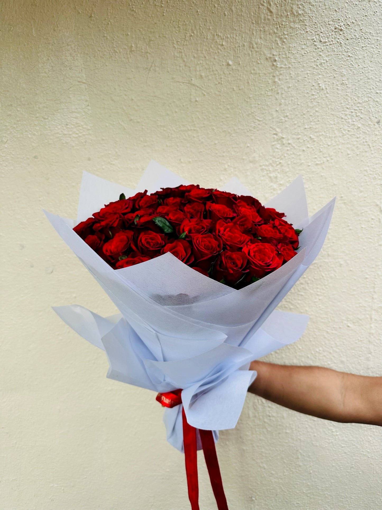 60 red roses hand bouquet