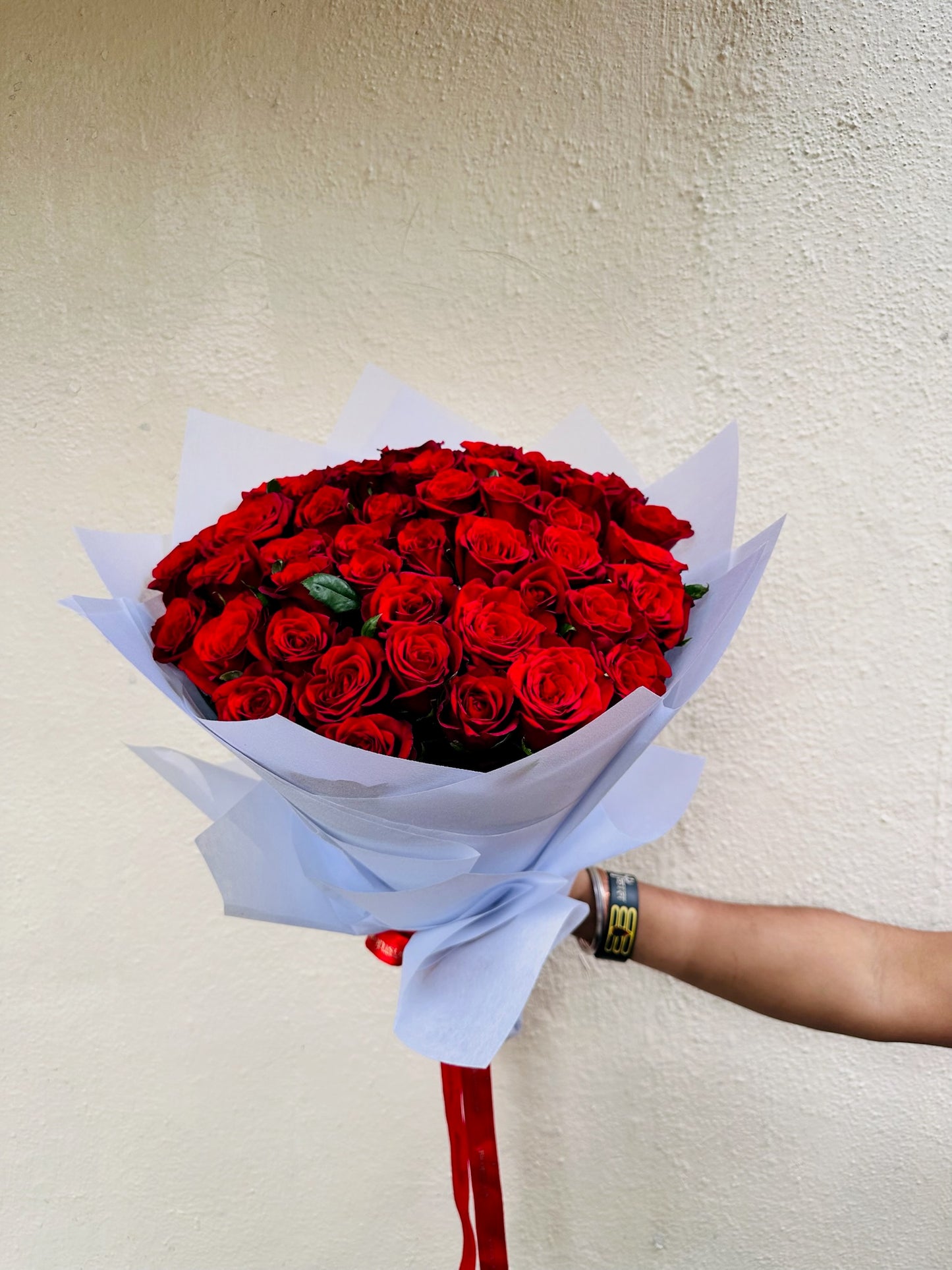 60 red roses hand bouquet