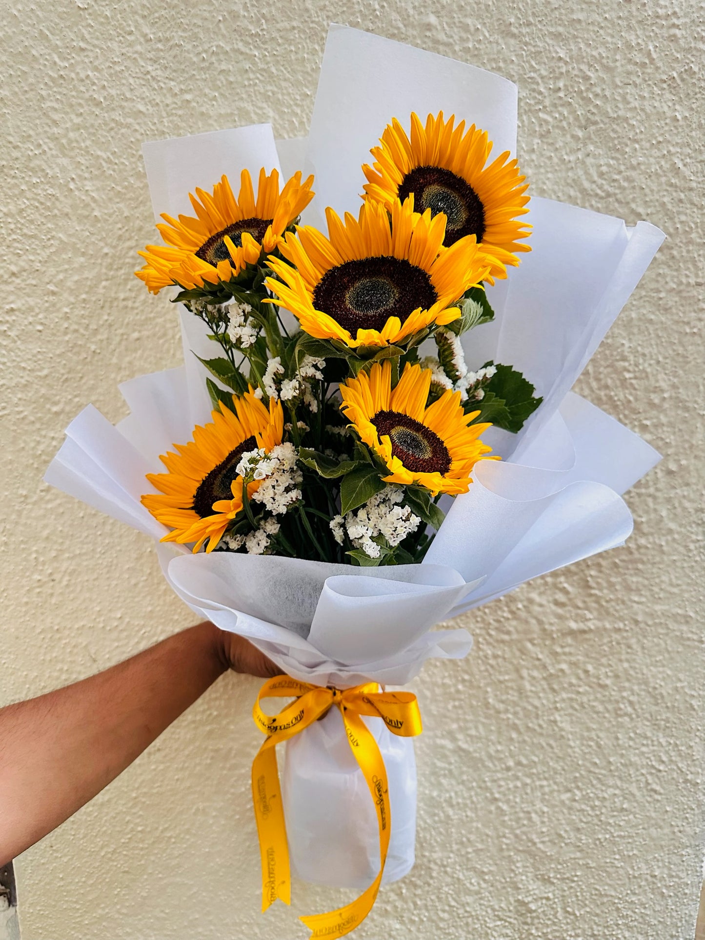 Sunflower hand bouquet by BloomOnly who is a premium number 1 florist in pune that delivers same day