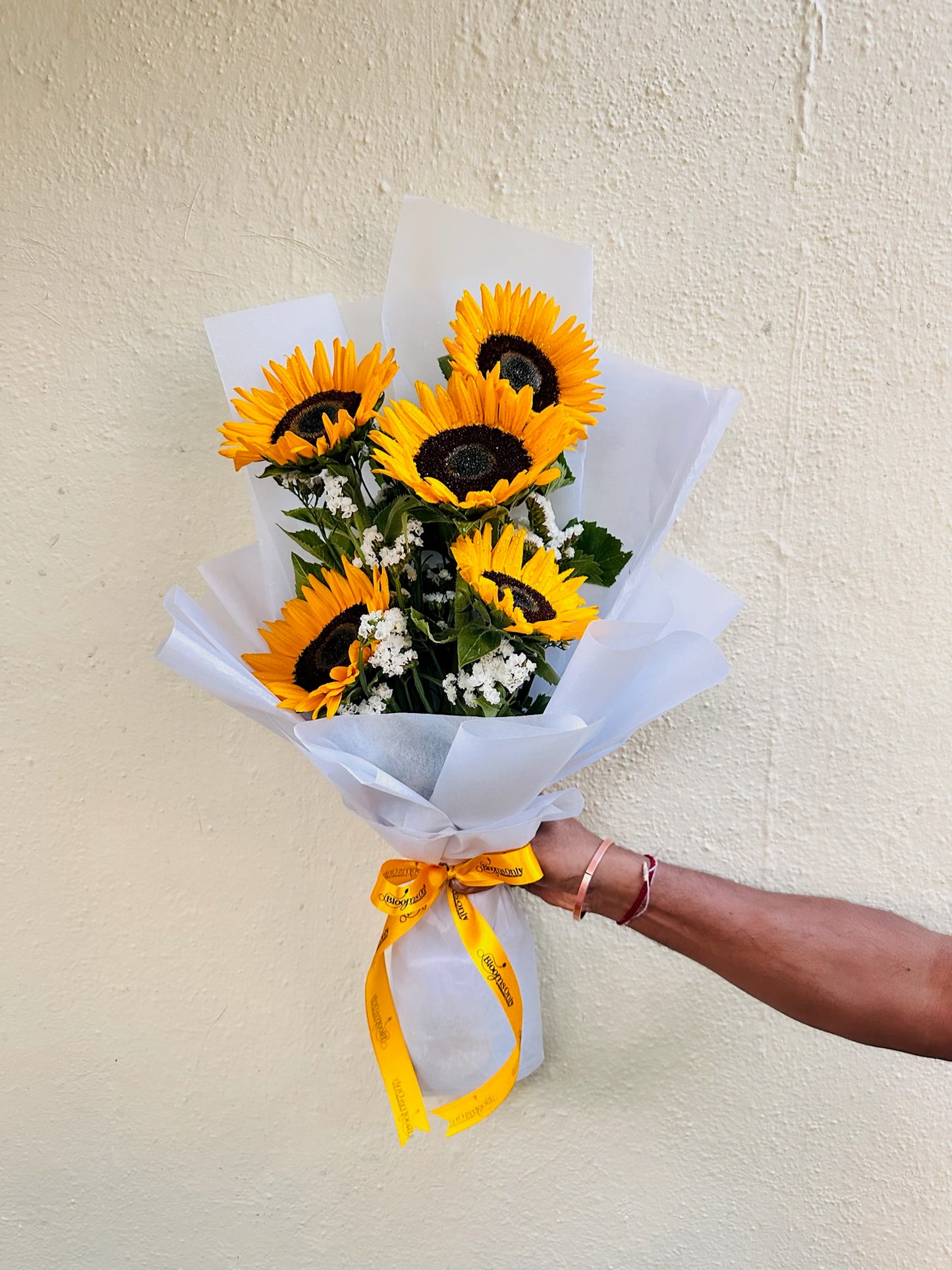 Sunflower hand bouquet by BloomOnly who is a premium number 1 florist in pune that delivers same day