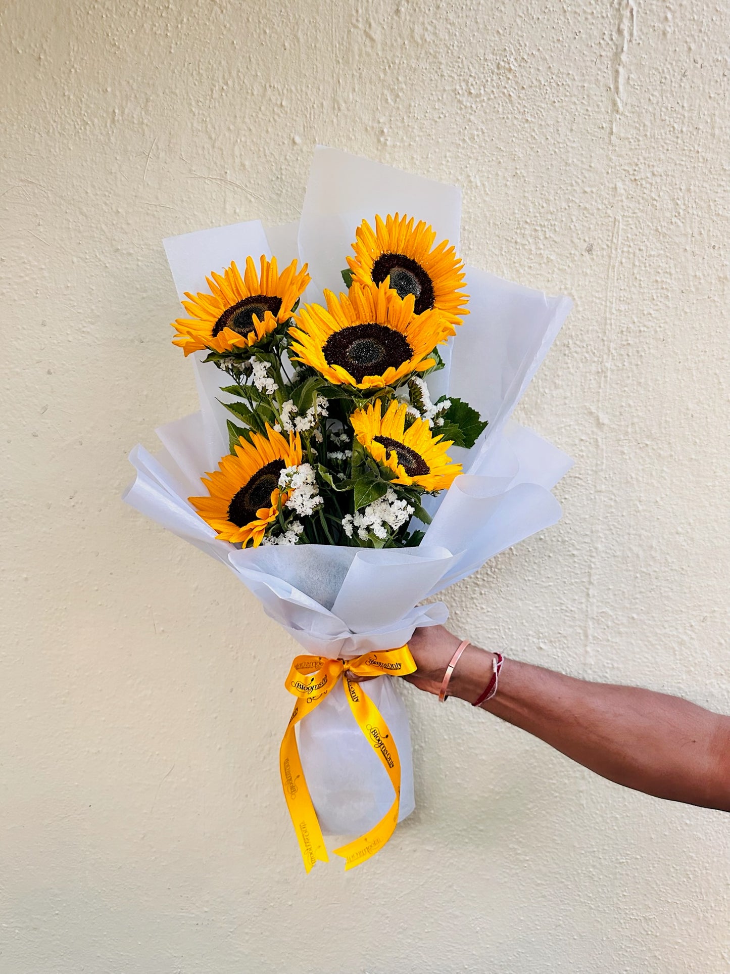 Sunflower hand bouquet by BloomOnly who is a premium number 1 florist in pune that delivers same day