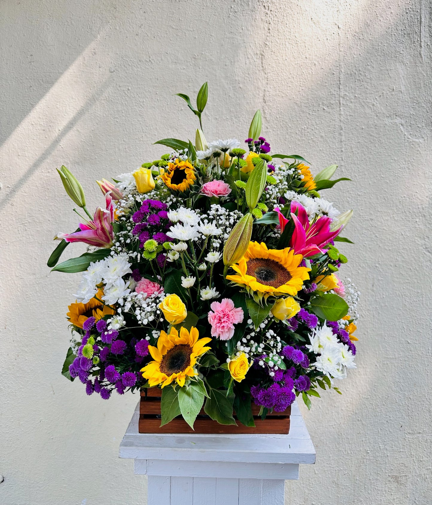 Wooden basket mix flowers by BloomsOnly, Pune's number 1 flower delivery website