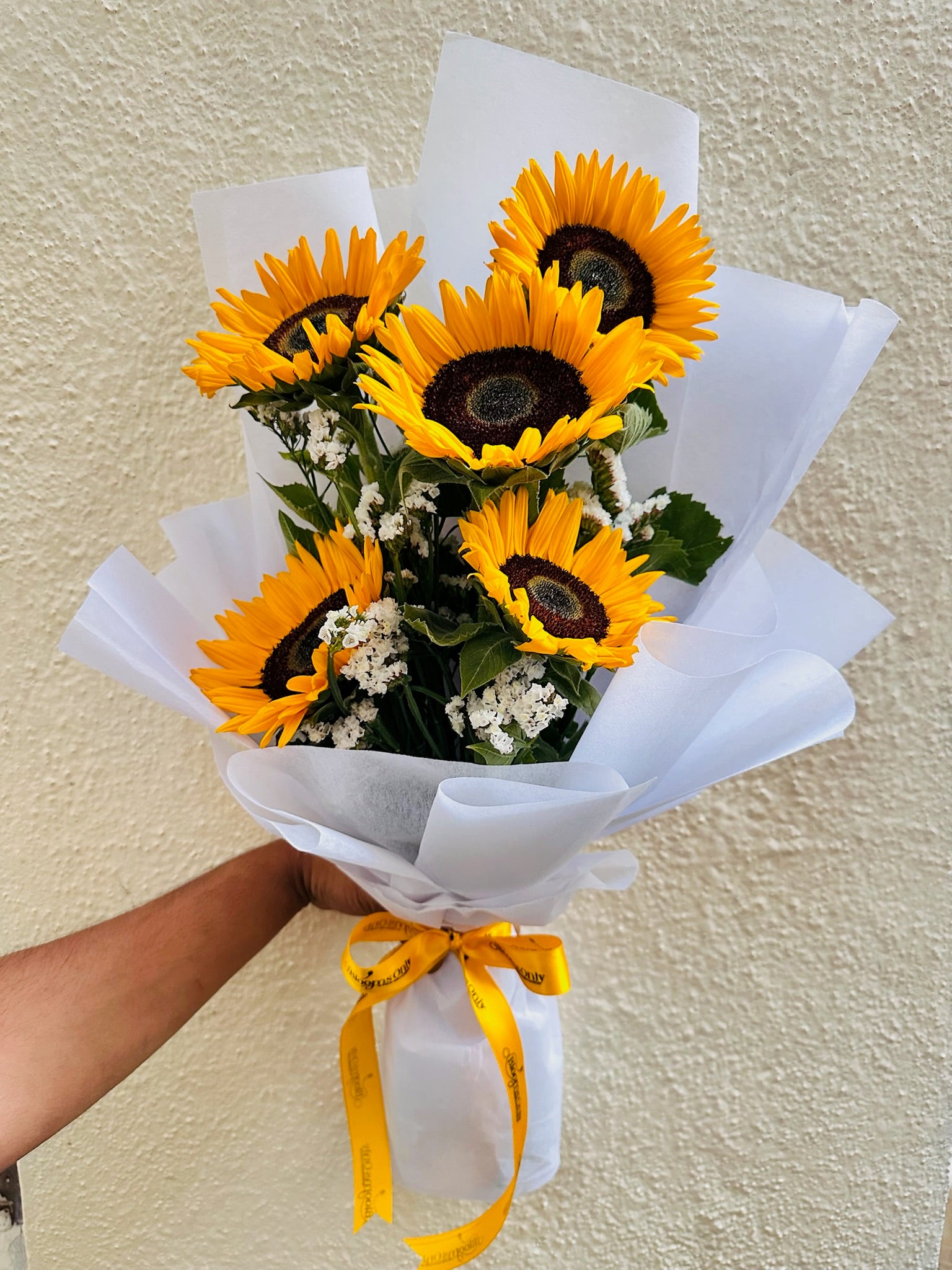 Sunflower hand bouquet by BloomOnly who is a premium number 1 florist in pune that delivers same day